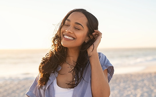 Pain Free Woman At The Beach Smiling
